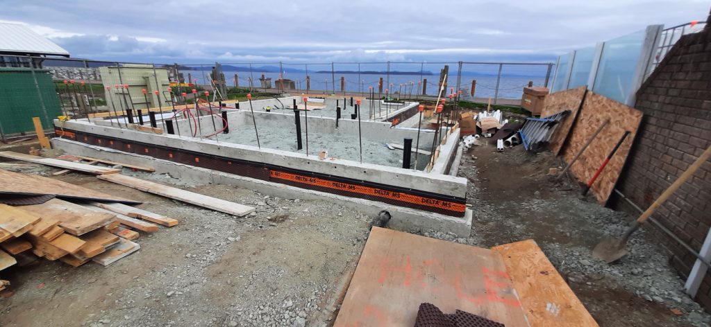 Waterfront washroom under construction with view of water