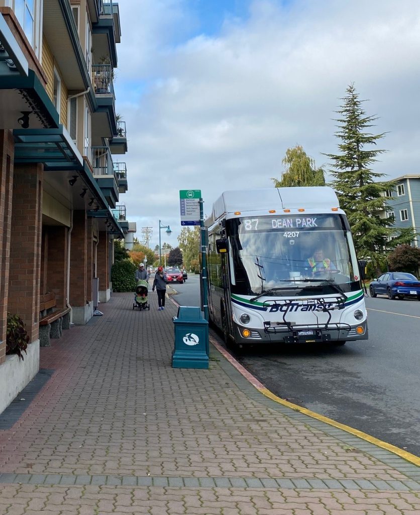 Public Bus stopped at corner of Fifth St and Sidney Ave