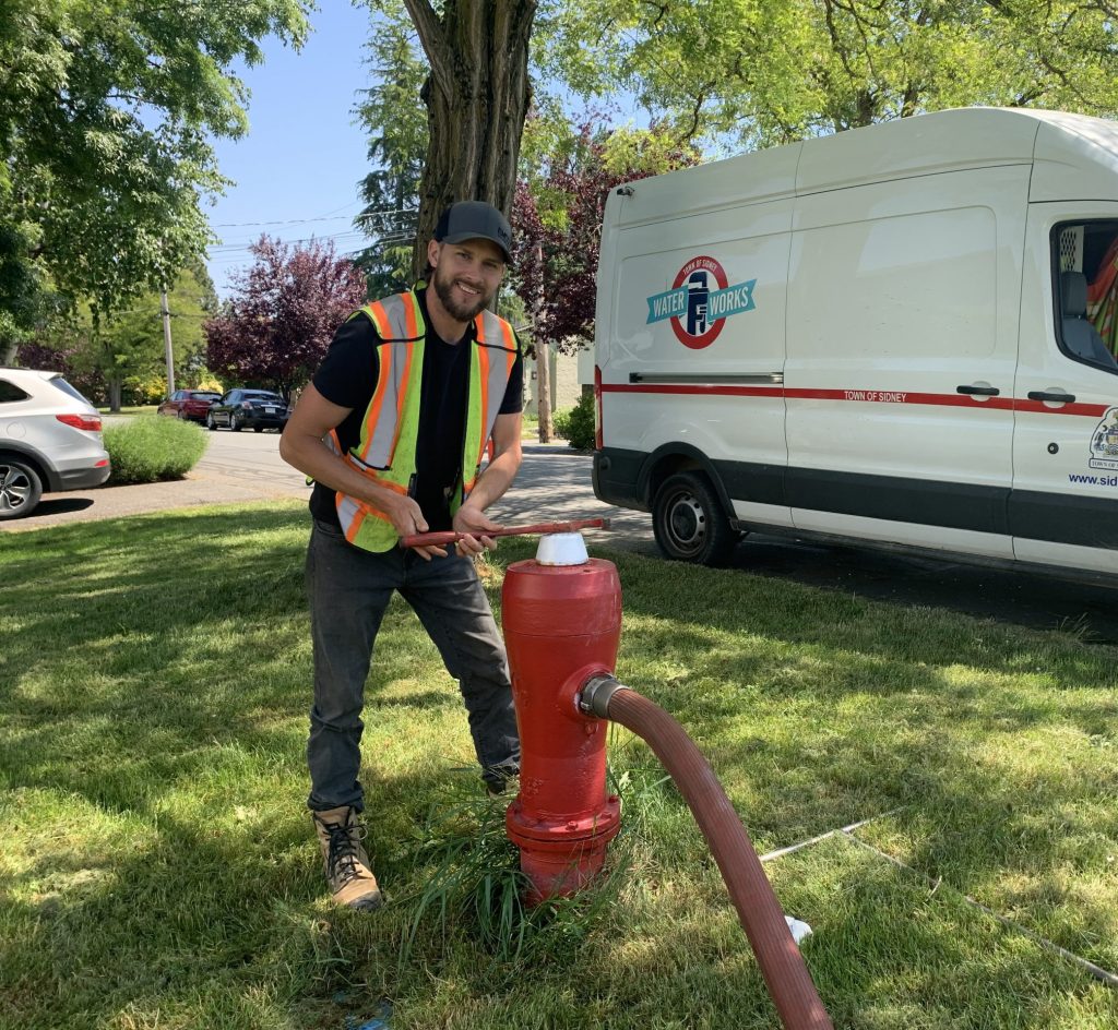 Staff member undertaking watermain flushing