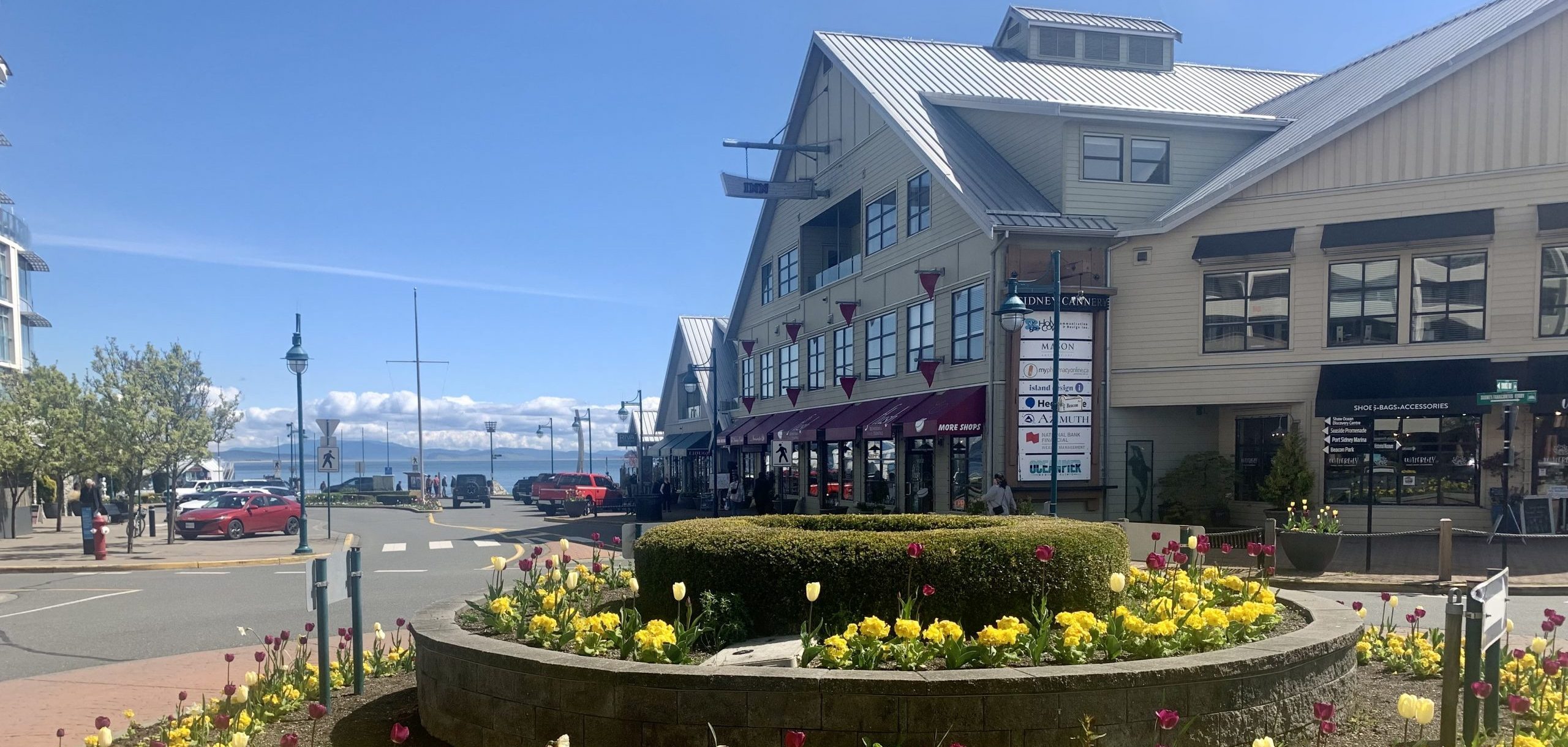 Cannery building with flowers in traffic circle