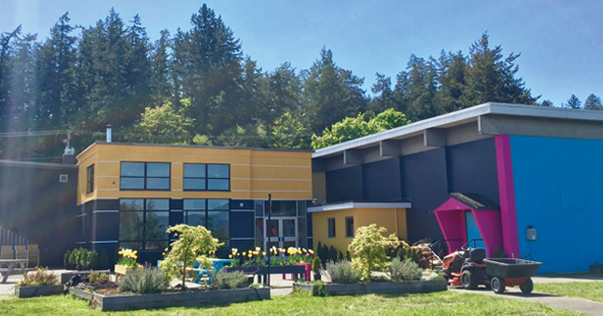 Back of McTavish Academy of Arts building with gardens