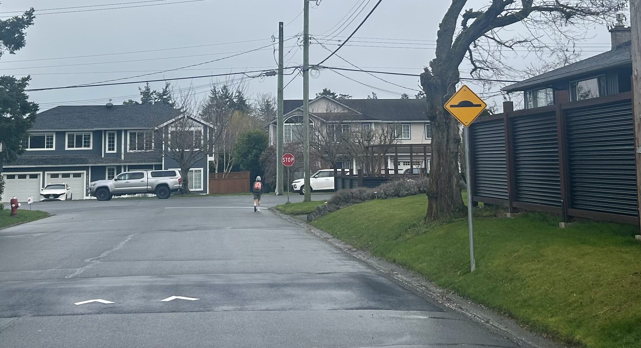 rainy day, view of speed hump sign and street