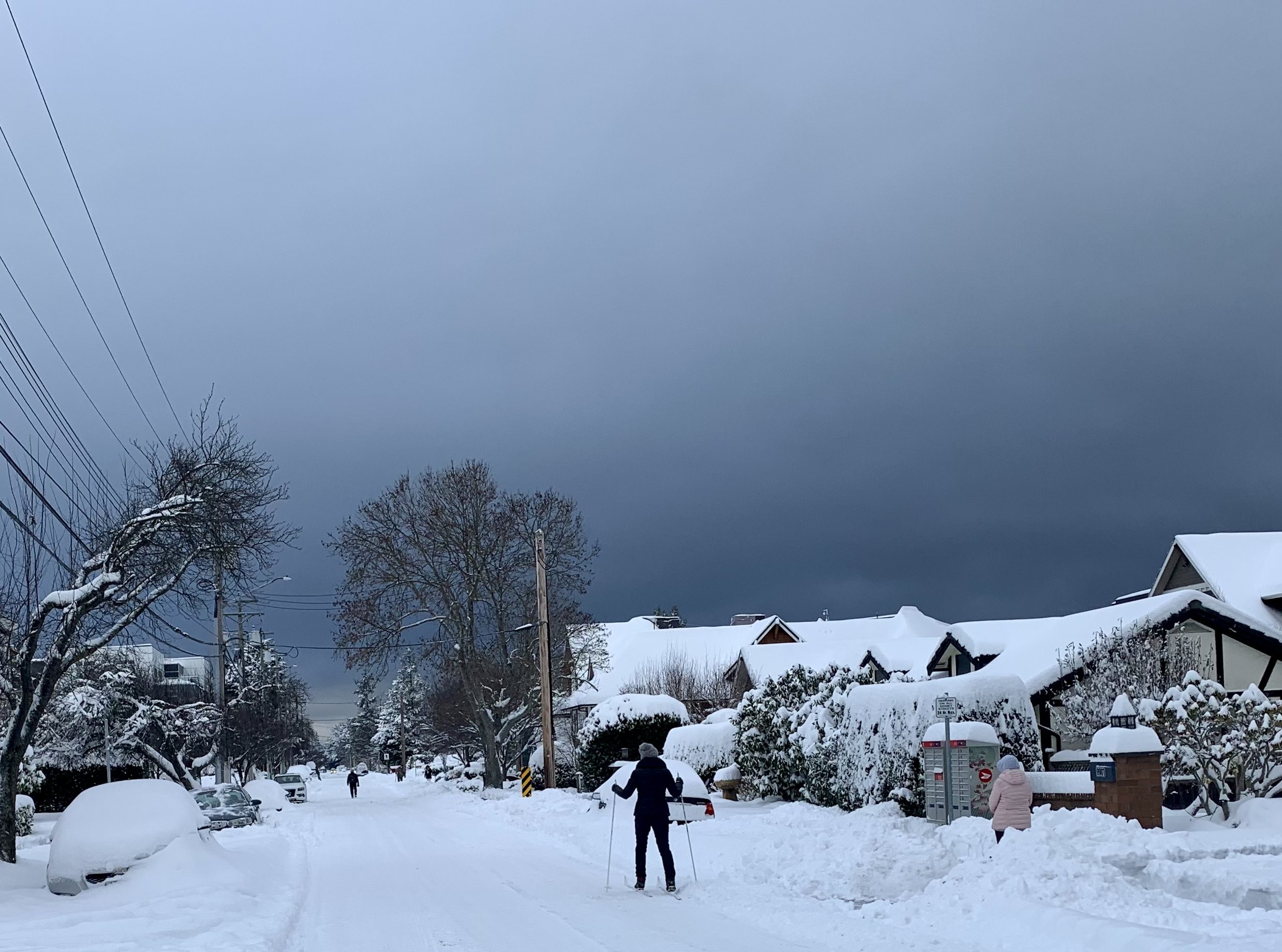 Snow on Third Street with cross-country skier