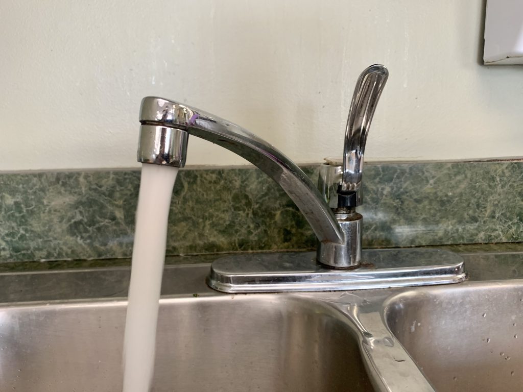 Kitchen sink with running water